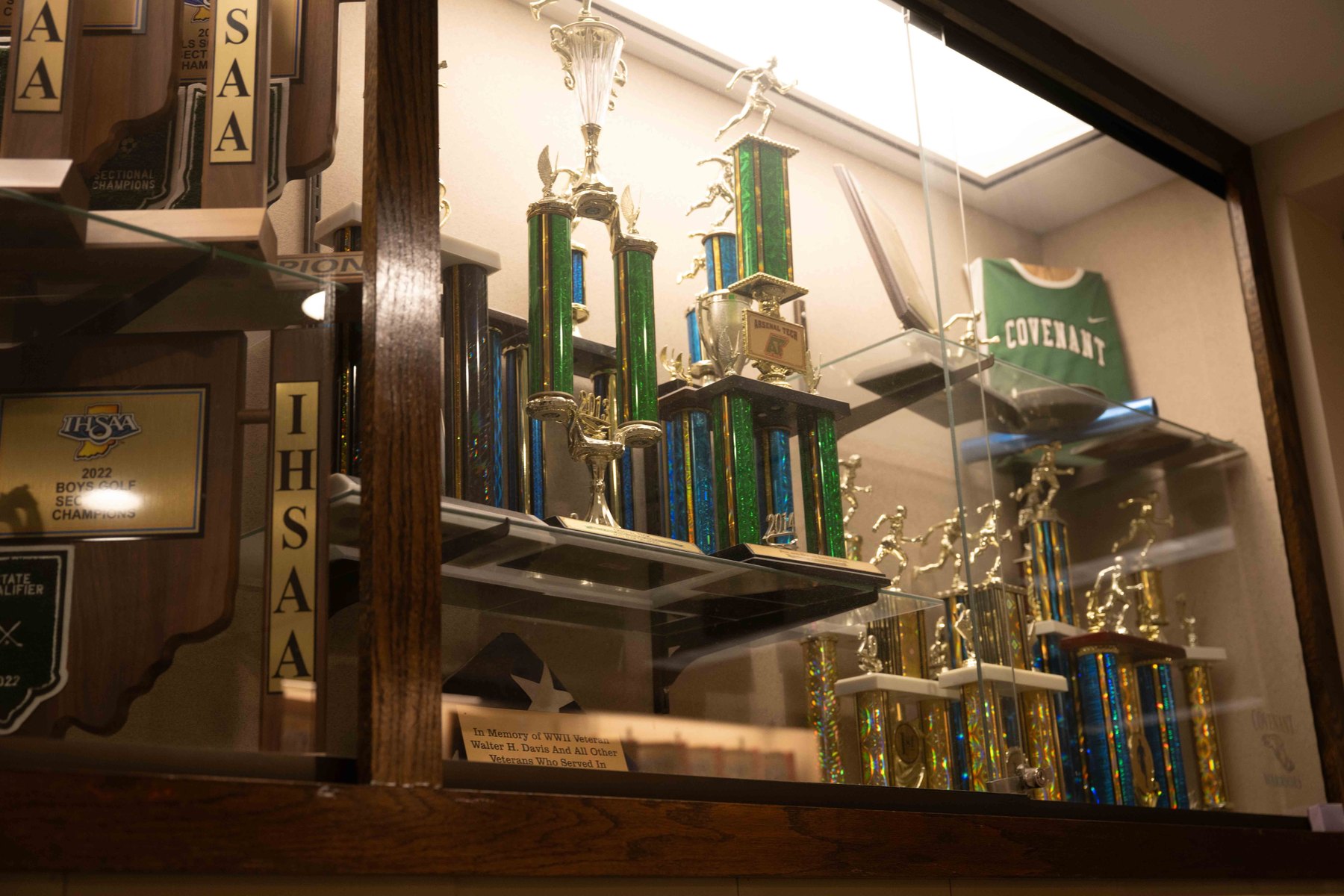 Championship trophies and plaques in the Covenant athletics trophy case